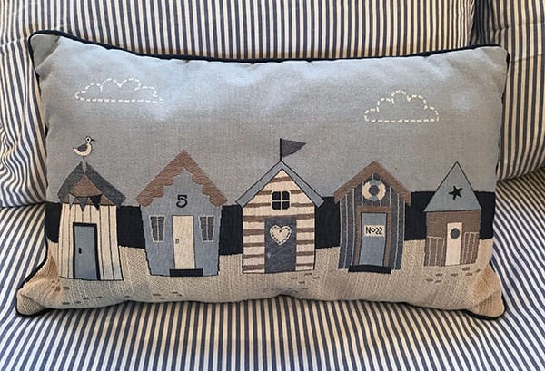 Cushion with beach hut design